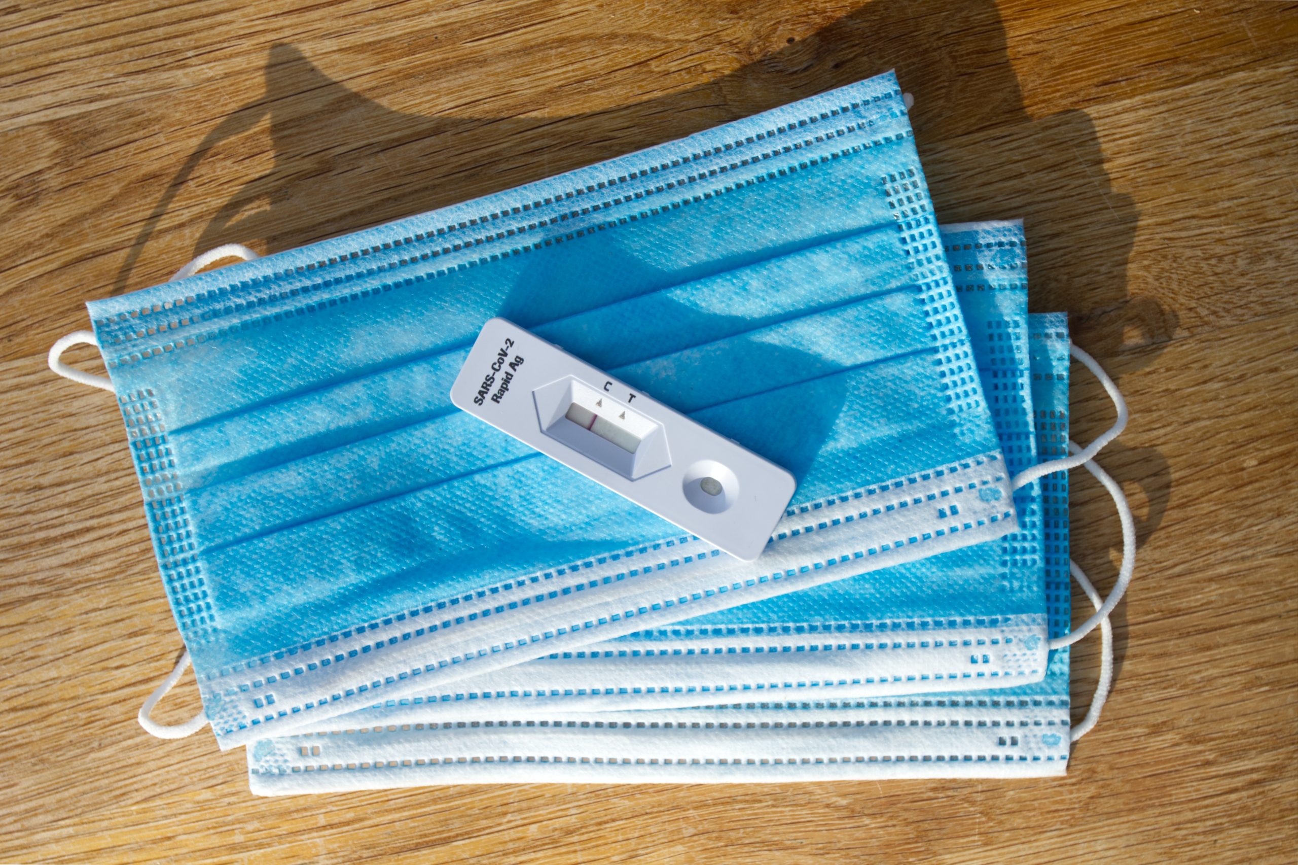 At-home COVID-19 antigen test on medical mask